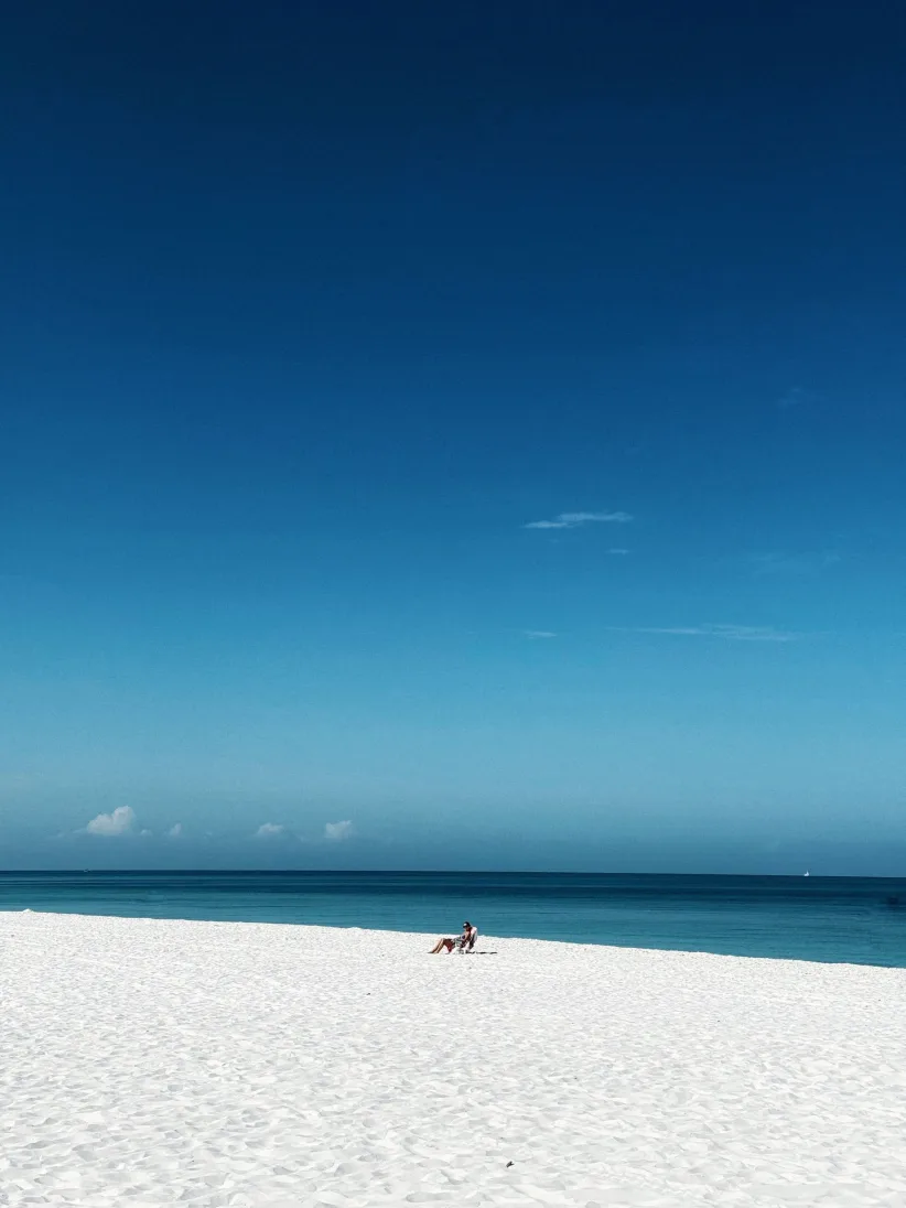 Naples beach under a clear blue sky