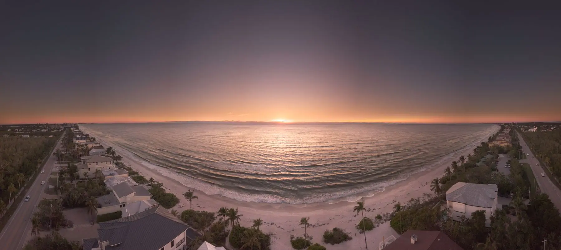 Naples beach and homes at golden hour